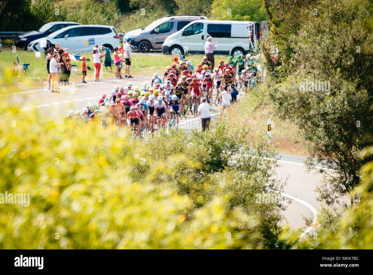 A bunch of cyclists during la vuelta of Spain Stock Photo