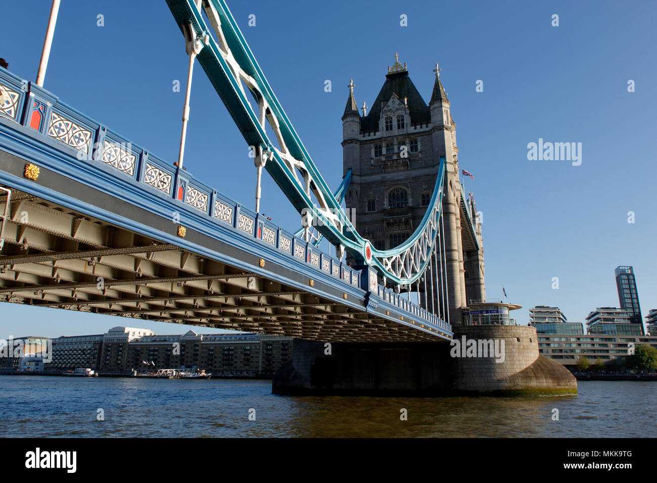 Tower Bridge in London, early morning light reflecting up to the underside, one of the most iconic man made structures in the world. Stock Photo