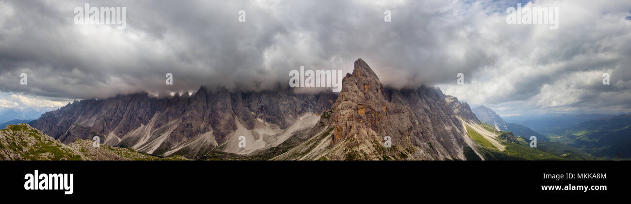 Panoramic clouds over the Sextner Rotwand, a mountain crest in the Dolomites Stock Photo