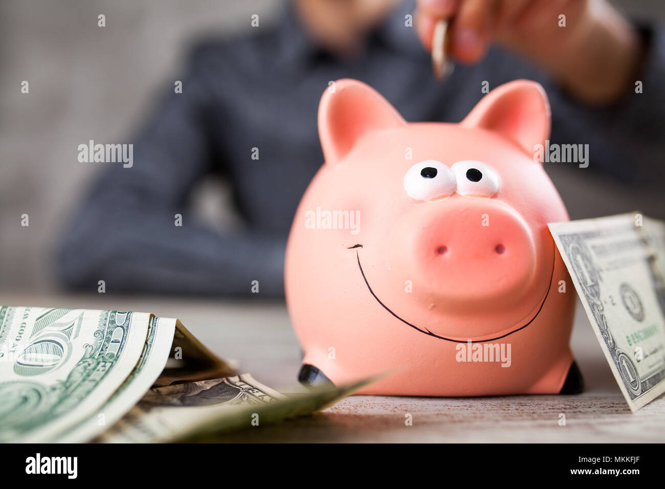 Piggy bank on grey background Stock Photo - Alamy