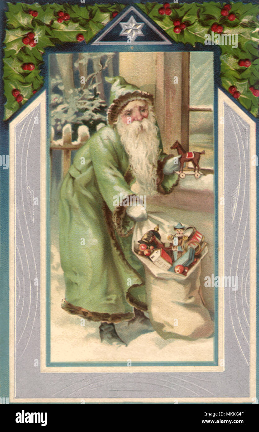 Santa in Green in Snow Stock Photo