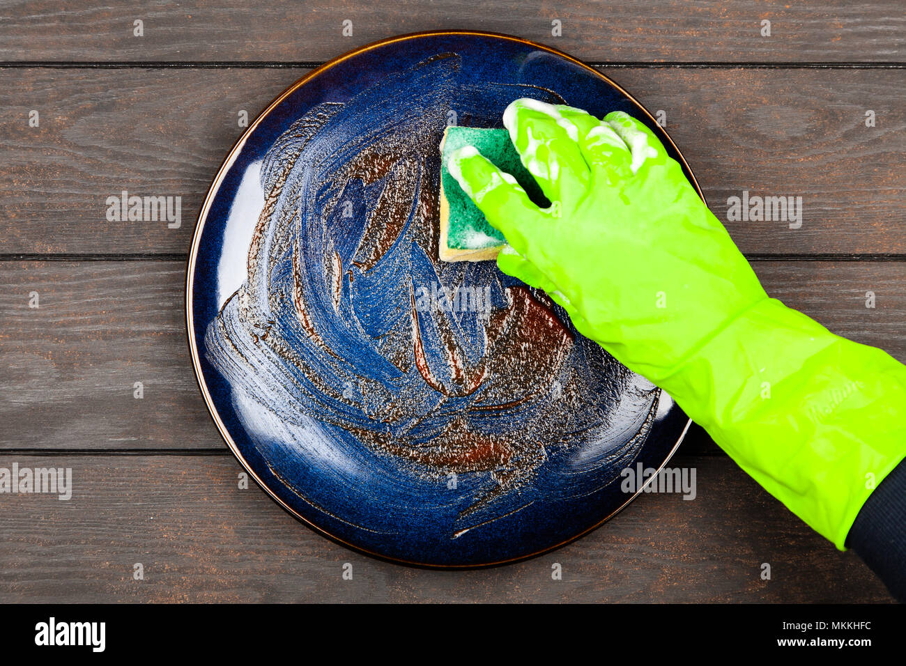 Blue plate on brown wooden table Stock Photo