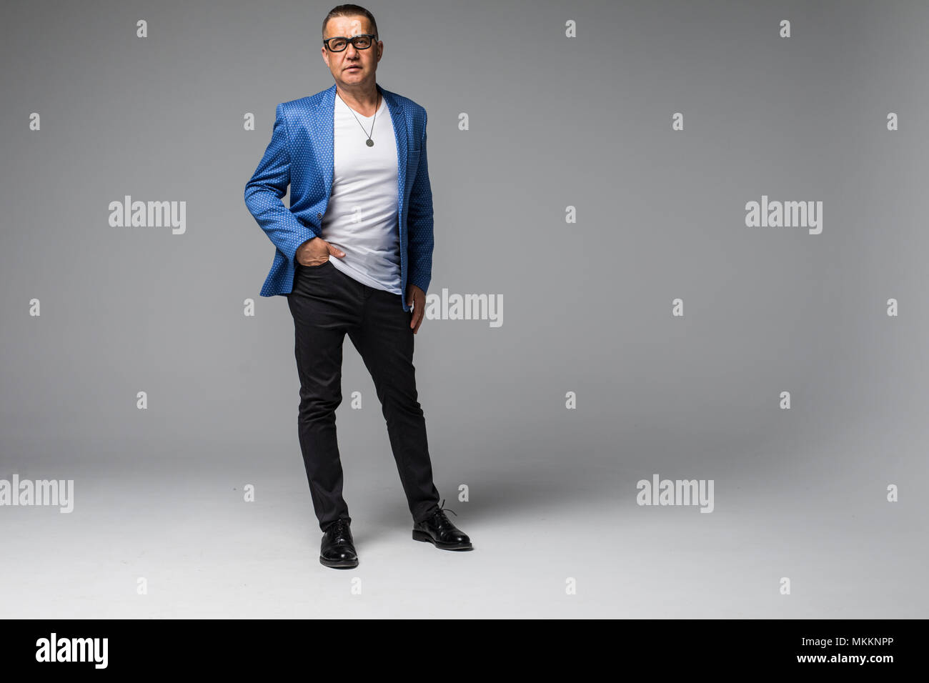 Full length portrait of confident mature businessman in formals ...