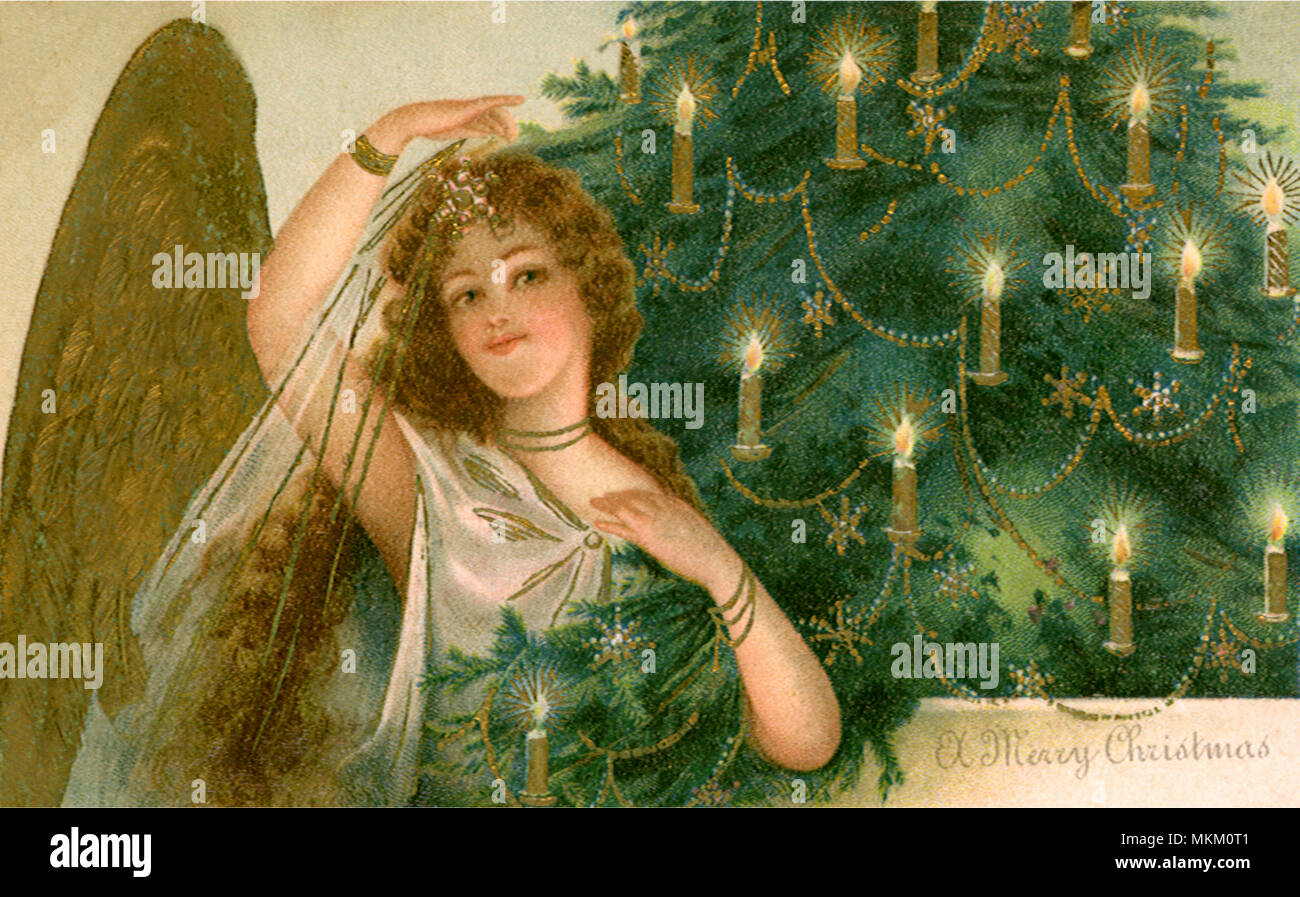 Angel and Lit Christmas Tree Stock Photo Alamy