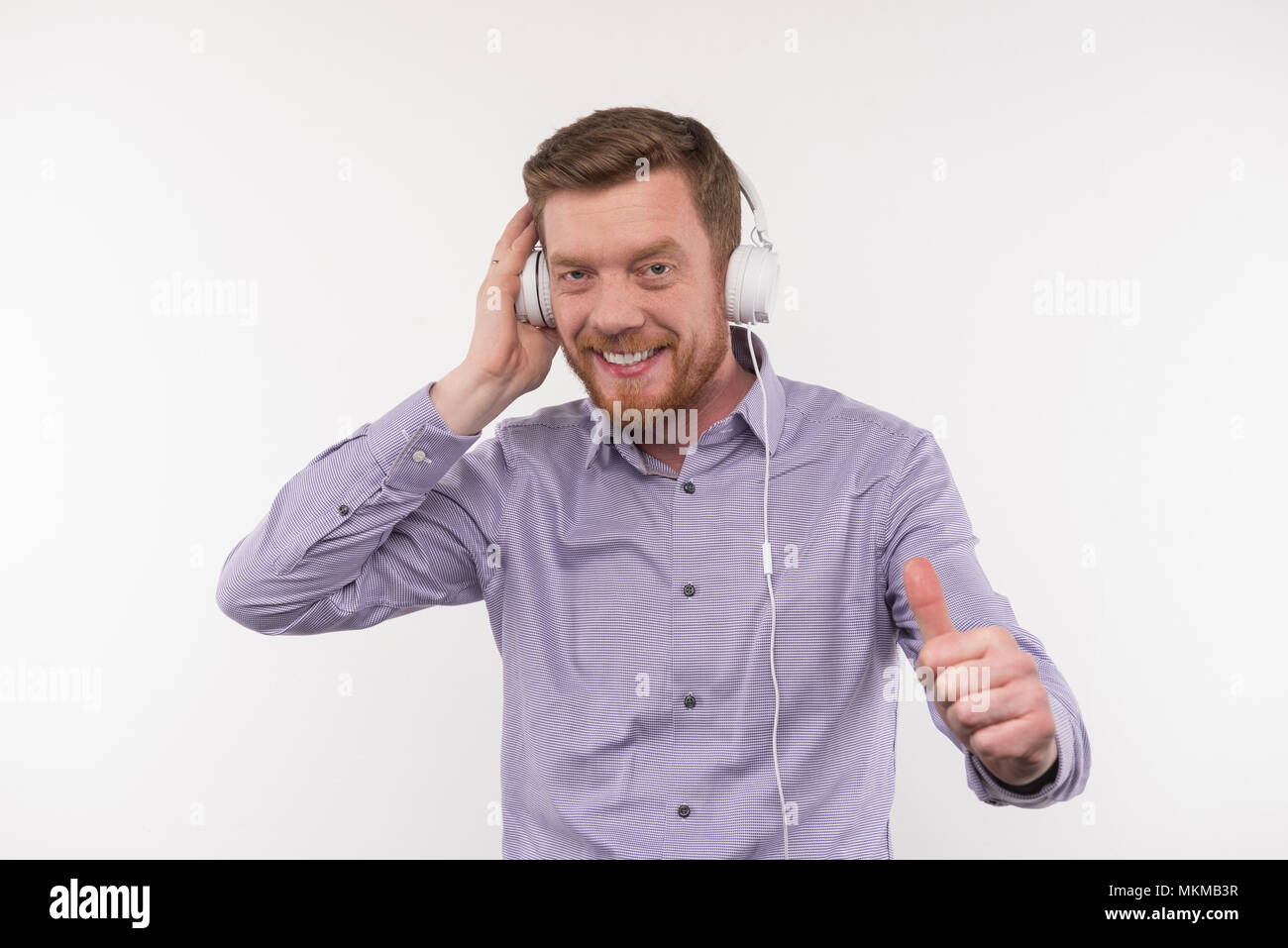 Happy millennial man listening hi-res stock photography and images - Alamy