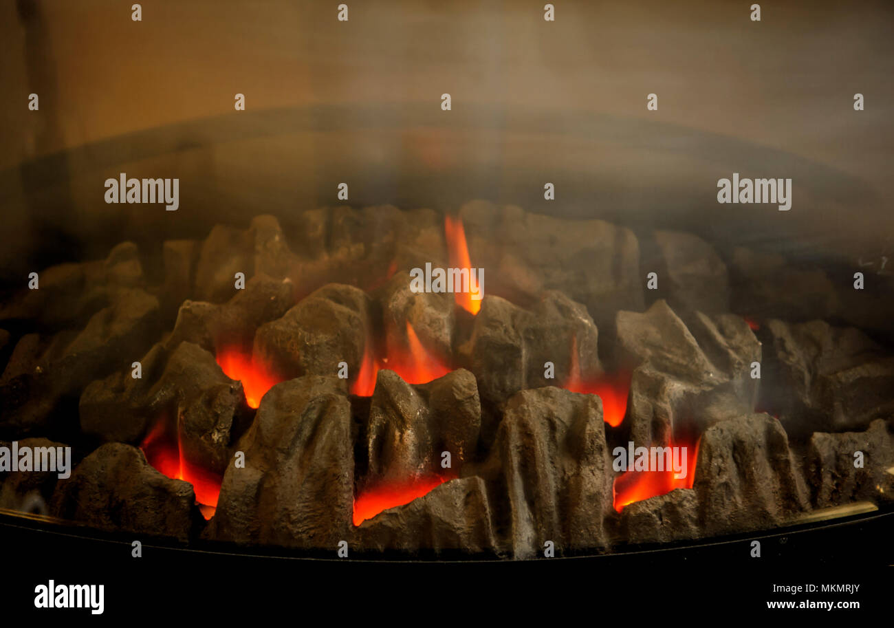 Fireplace a comfortable source of heating Stock Photo Alamy