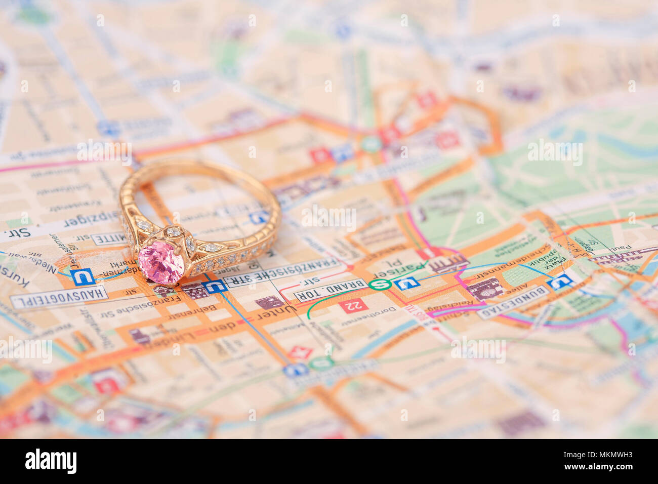 Luxury golden ring on the paper map background Stock Photo - Alamy