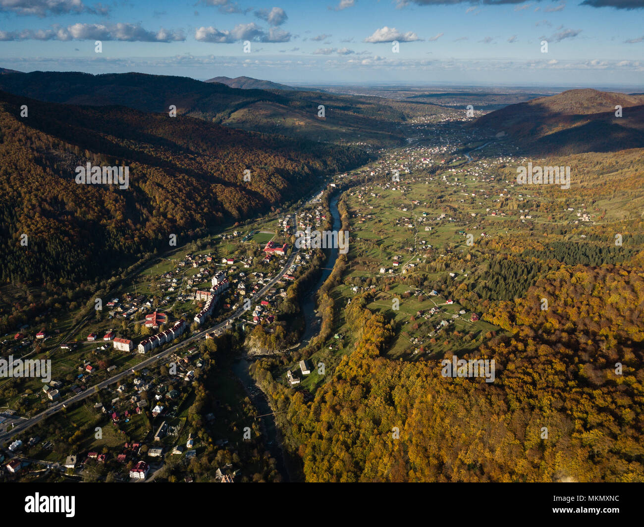 Aerial autumn top view of the Carpathian village at sunny day, Ukraine ...