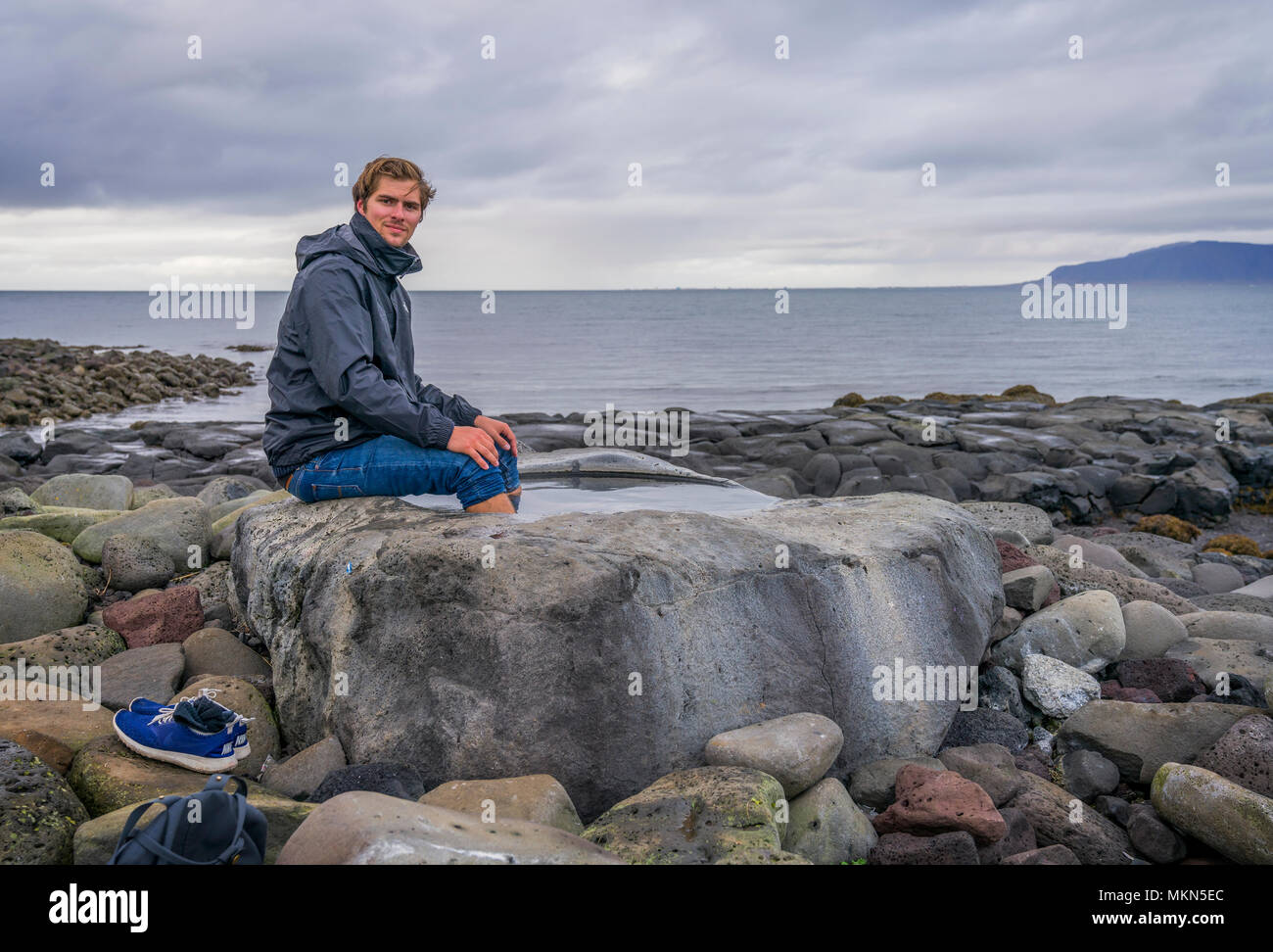 Male using the warm foot bath at Grotta, Reykjavik, Iceland Stock Photo