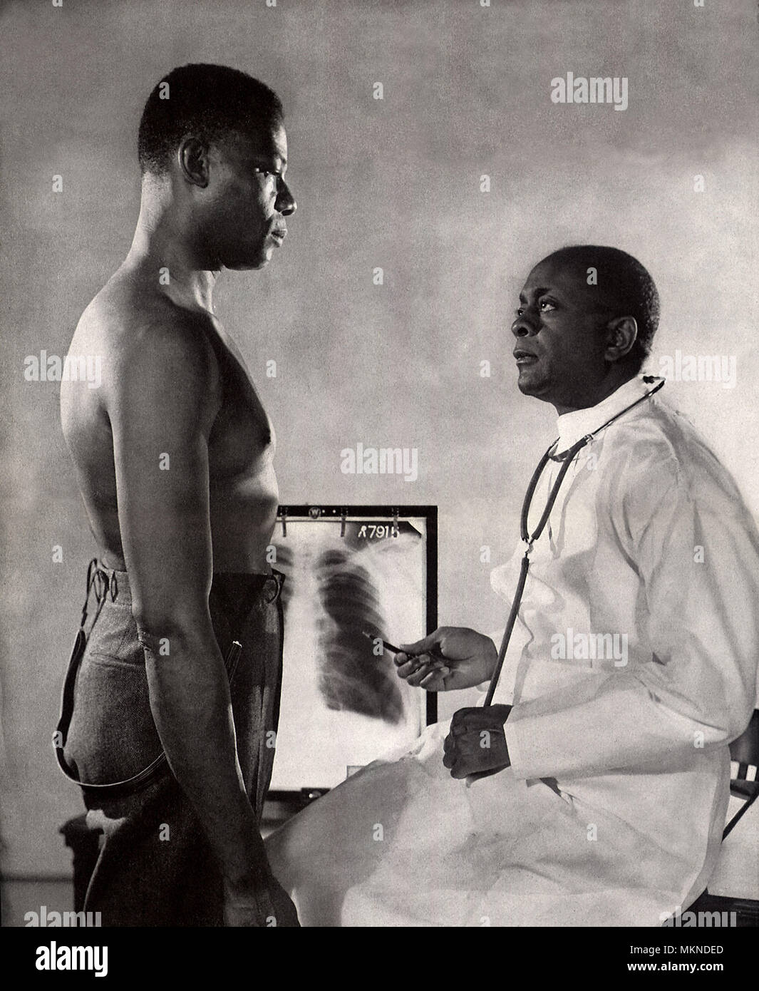 Doctor Examines Patient Stock Photo