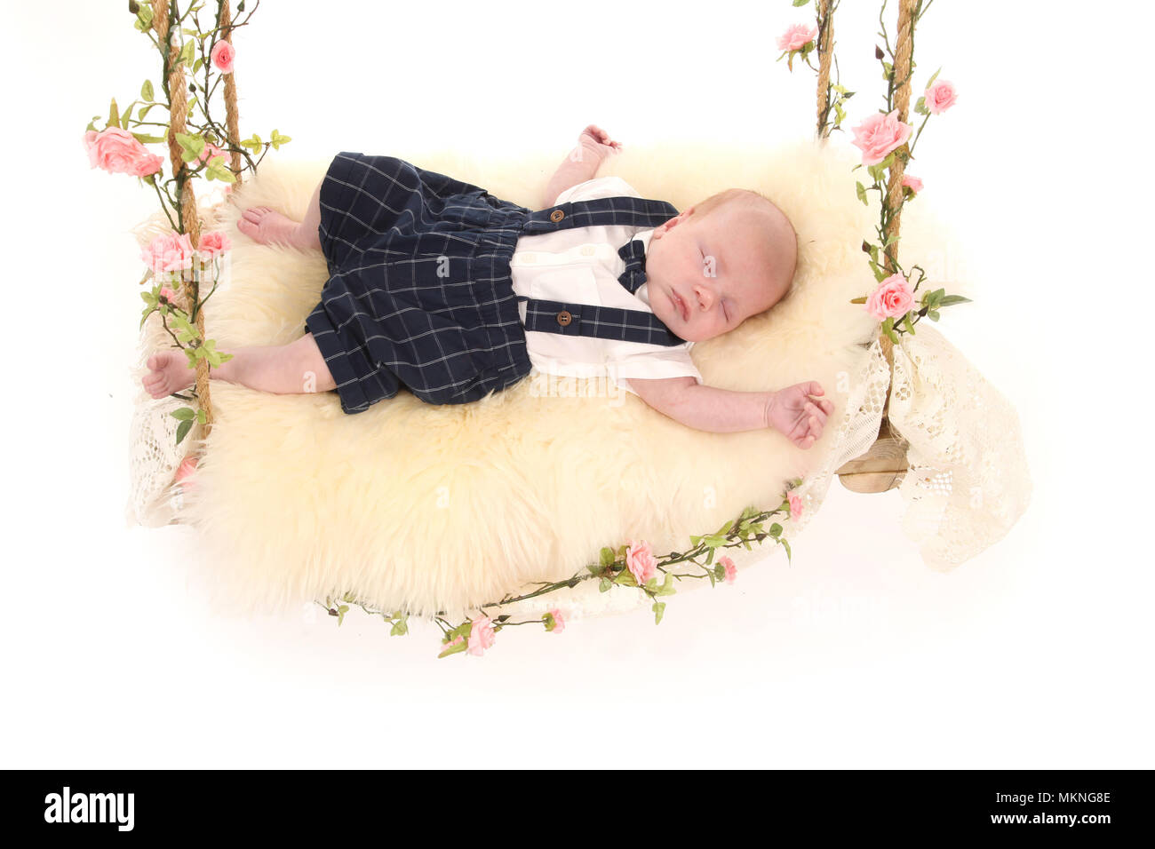 6 week old baby boy on a swing Stock Photo Alamy