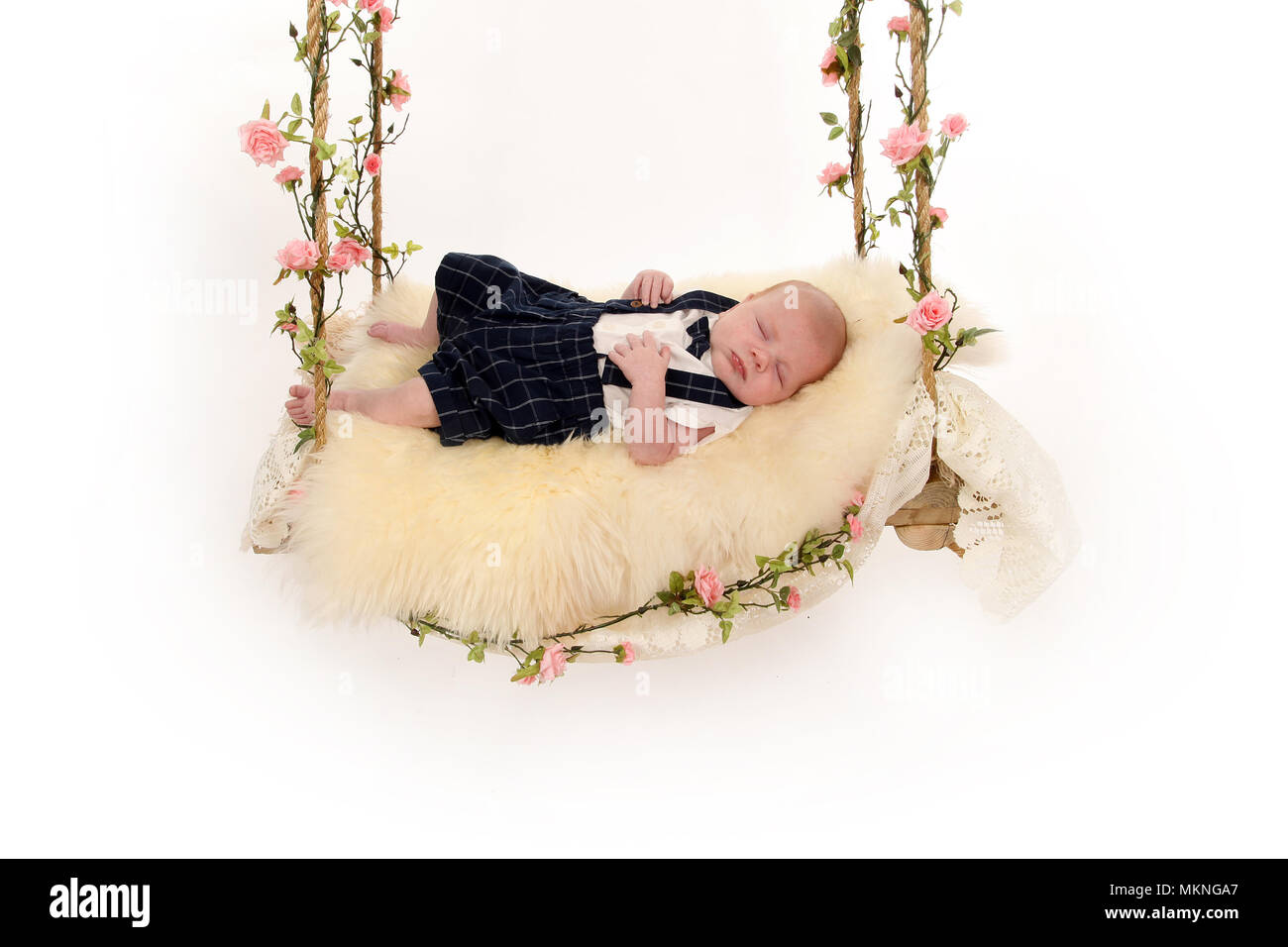 6 week old baby boy on a swing Stock Photo Alamy
