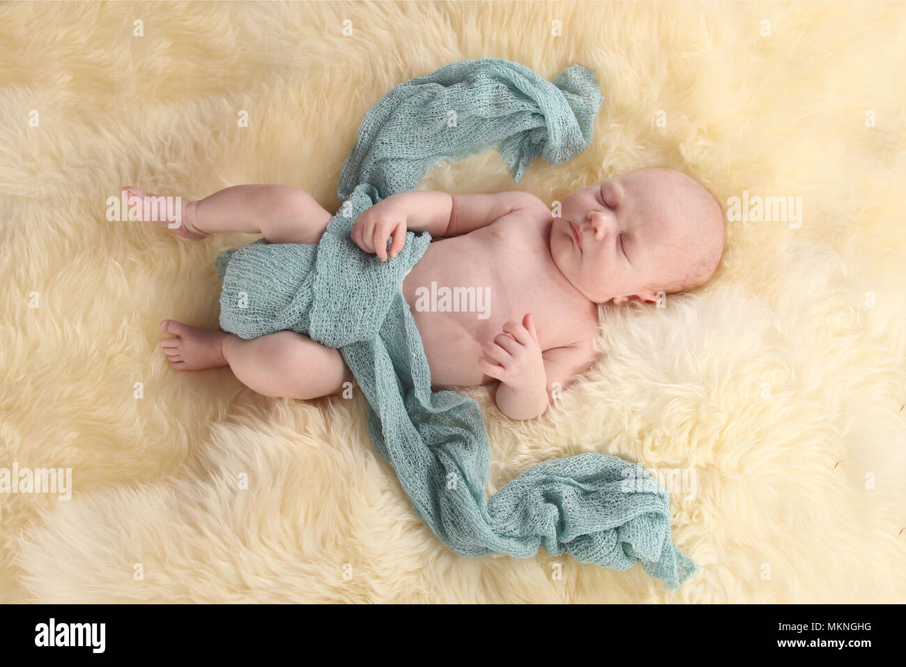 6 week old baby boy sleeping and relaxing on rug Stock Photo Alamy