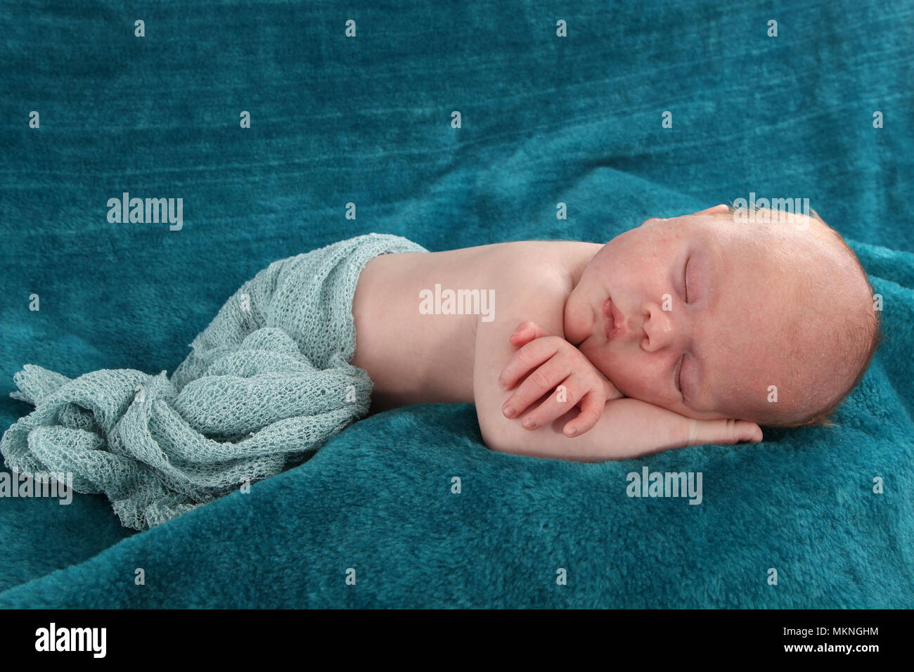 6 week old baby boy sleeping and relaxing on rug Stock Photo Alamy