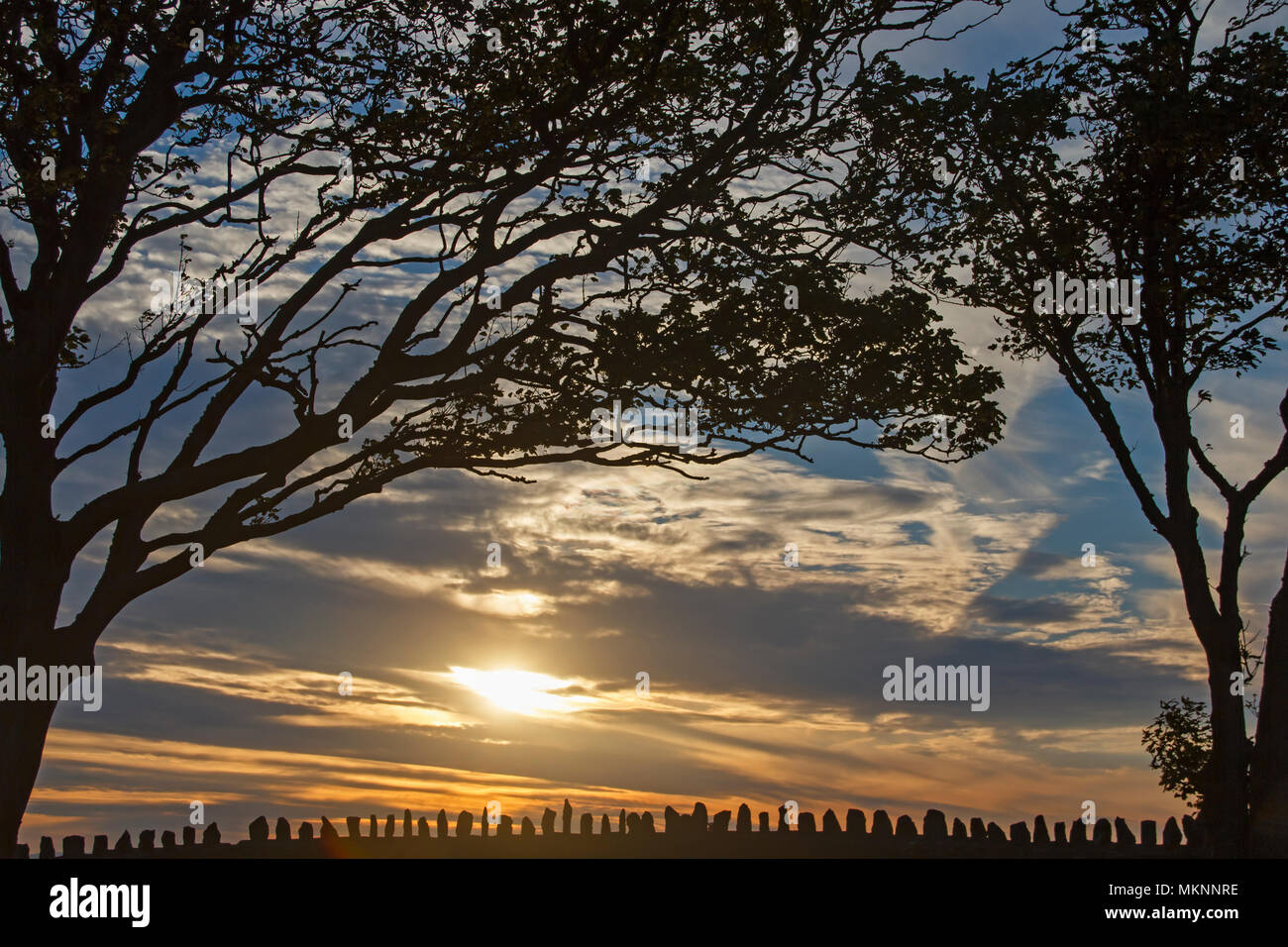 Sunset stone wall Stock Photo - Alamy