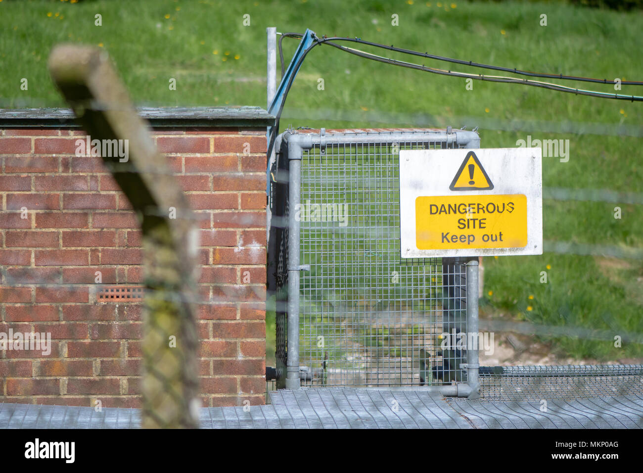 Dangerous Site Keep Out sign. Warning at industrial facility Stock Photo
