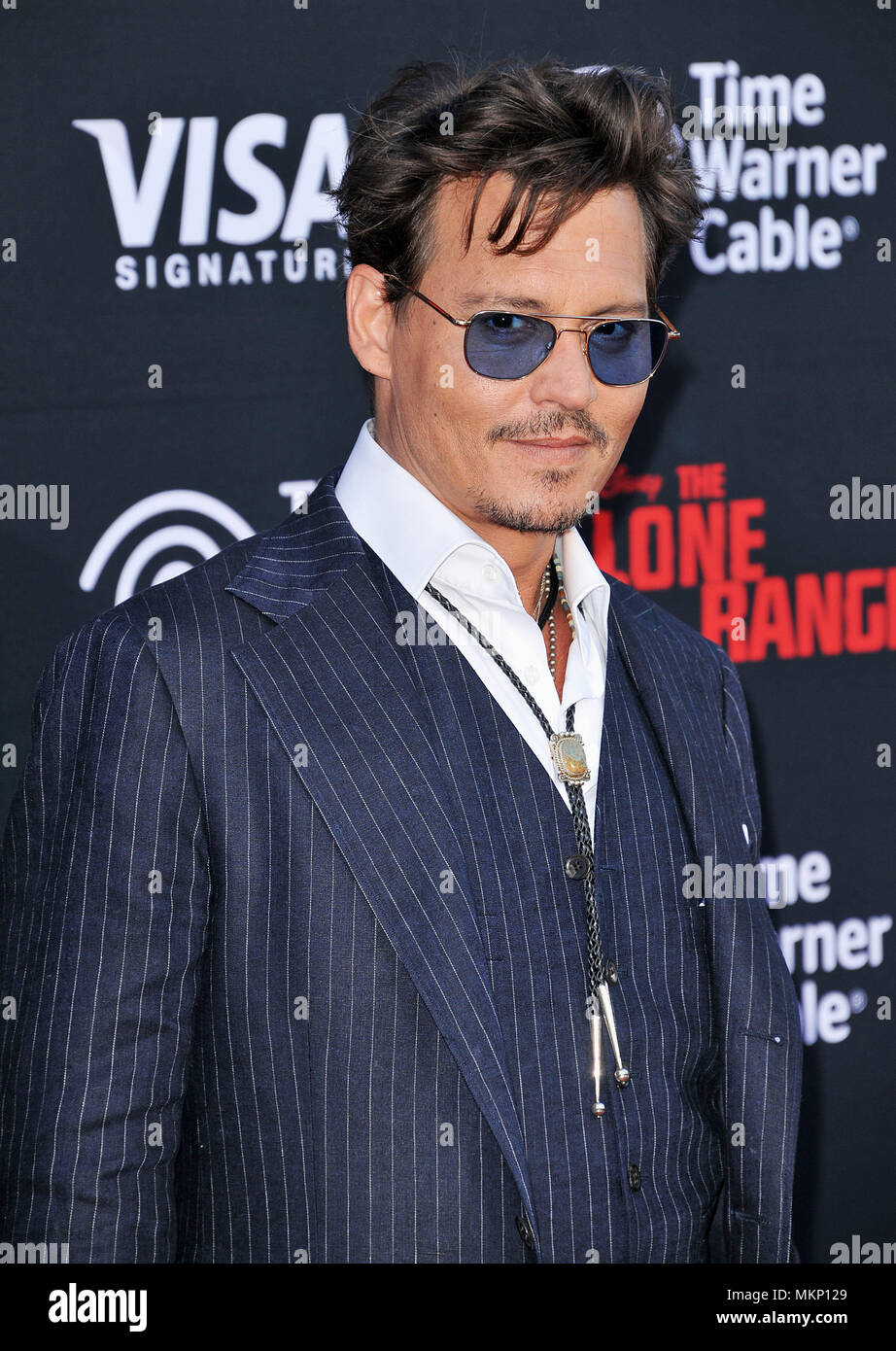 Johnny Depp arriving at the Lone Ranger premiere at the Disney ...