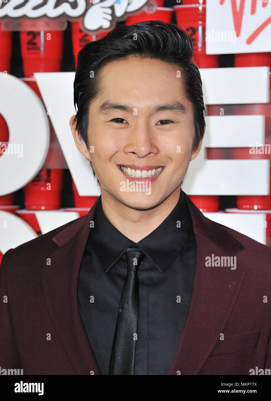 Justin Chon  02 at the 21 and Over premiere at the Westwood Village Theatre in Los Angeles.Justin Chon  02 Red Carpet Event, Vertical, USA, Film Industry, Celebrities,  Photography, Bestof, Arts Culture and Entertainment, Topix Celebrities fashion /  Vertical, Best of, Event in Hollywood Life - California,  Red Carpet and backstage, USA, Film Industry, Celebrities,  movie celebrities, TV celebrities, Music celebrities, Photography, Bestof, Arts Culture and Entertainment,  Topix, headshot, vertical, one person,, from the year , 2013, inquiry tsuni@Gamma-USA.com Stock Photo