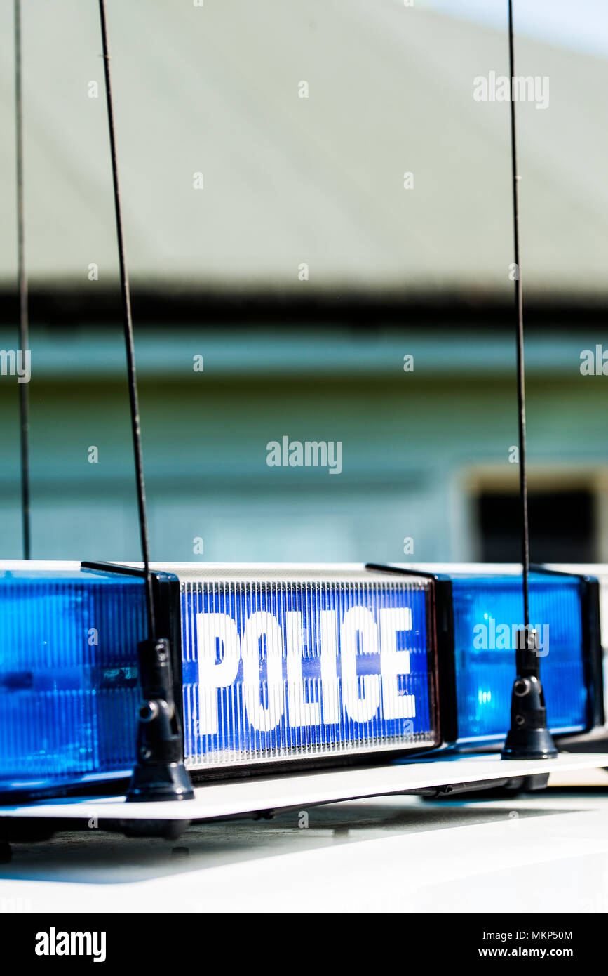 Police sign with blue lights on top of a patrol vehicle Stock Photo - Alamy