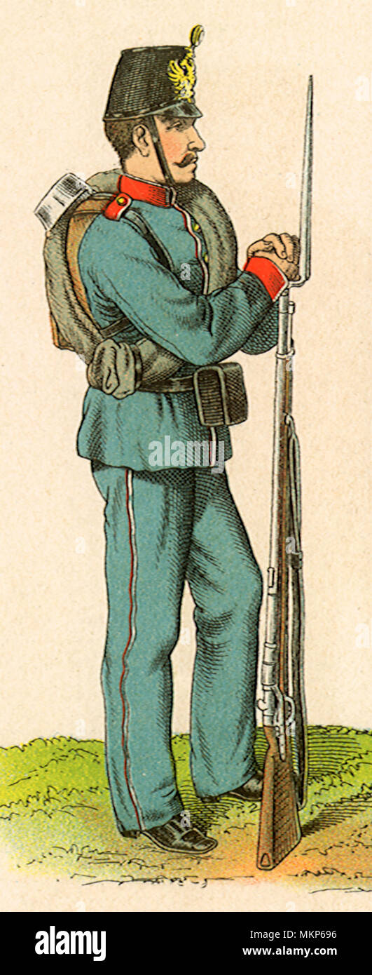 Soldier Leans on Rifle Stock Photo