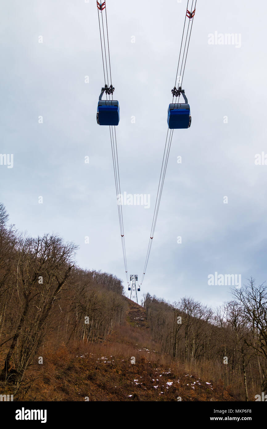 Two Cabins And Pylon Of The Cableway Over The Mountainside With