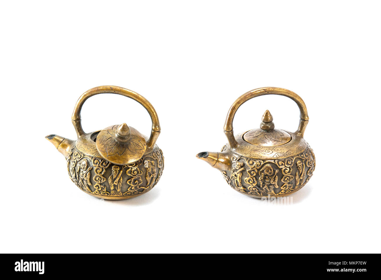 Miniature antique brass teapot isolated on white background Stock Photo