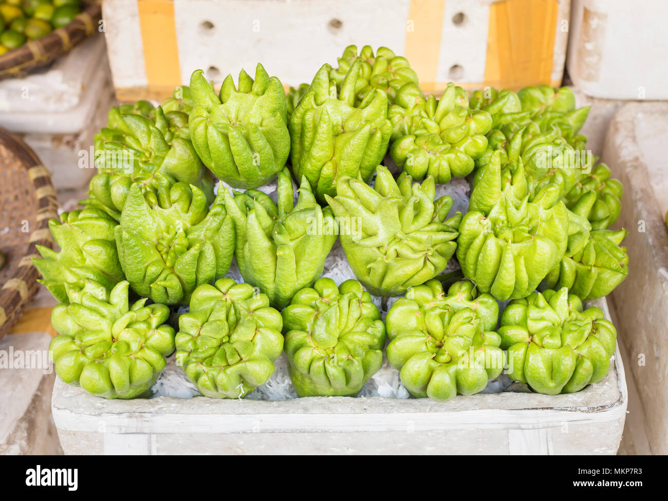 Fingered citrons, aka Buddha's hands or Buddha's fingers for sale in Hanoi, Vietnam Stock Photo