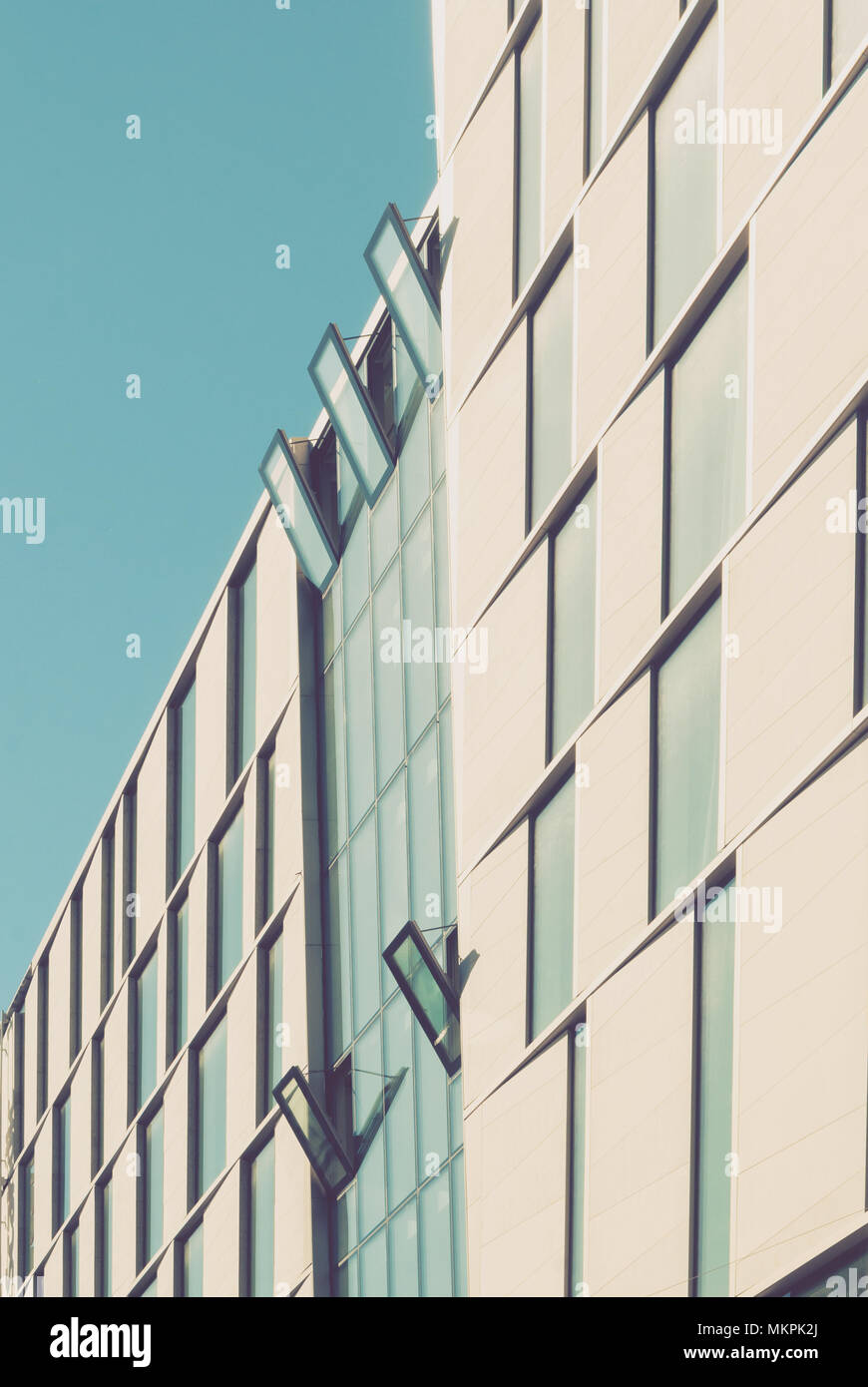 Facade of a modern building against the blue sky Stock Photo - Alamy