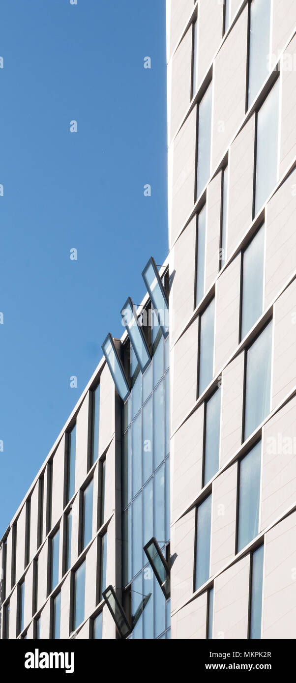 Facade of a modern building against the blue sky Stock Photo - Alamy
