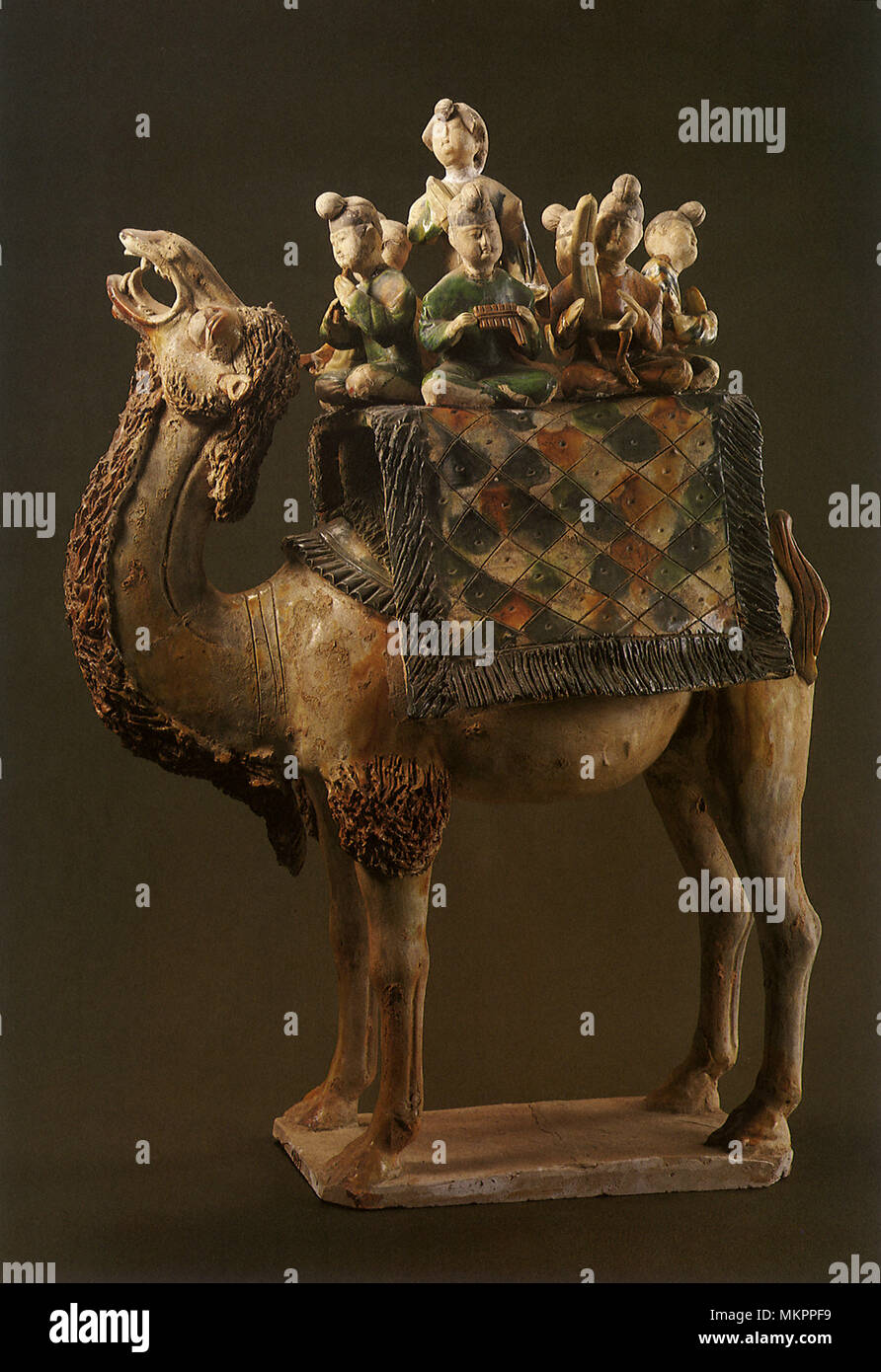 Statuette of Musicians Mounted on a Camel Stock Photo
