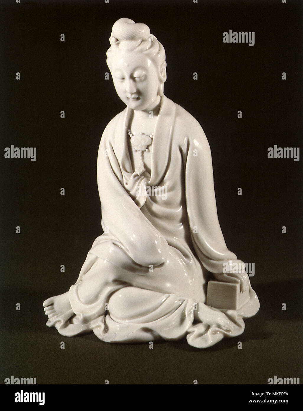 Statuette of Seated Guanyin Stock Photo