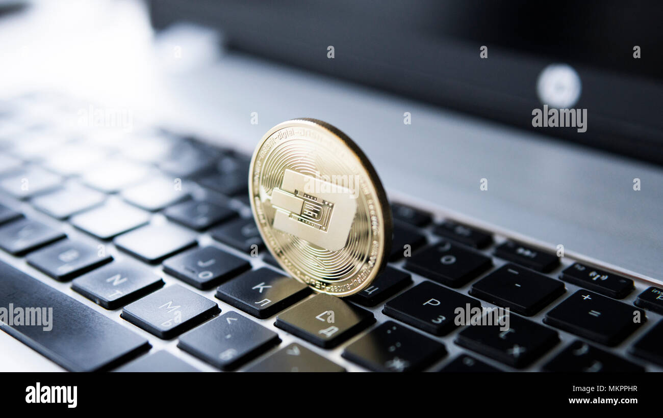 golden dash cryptocurrency on laptop keyboard virtual money