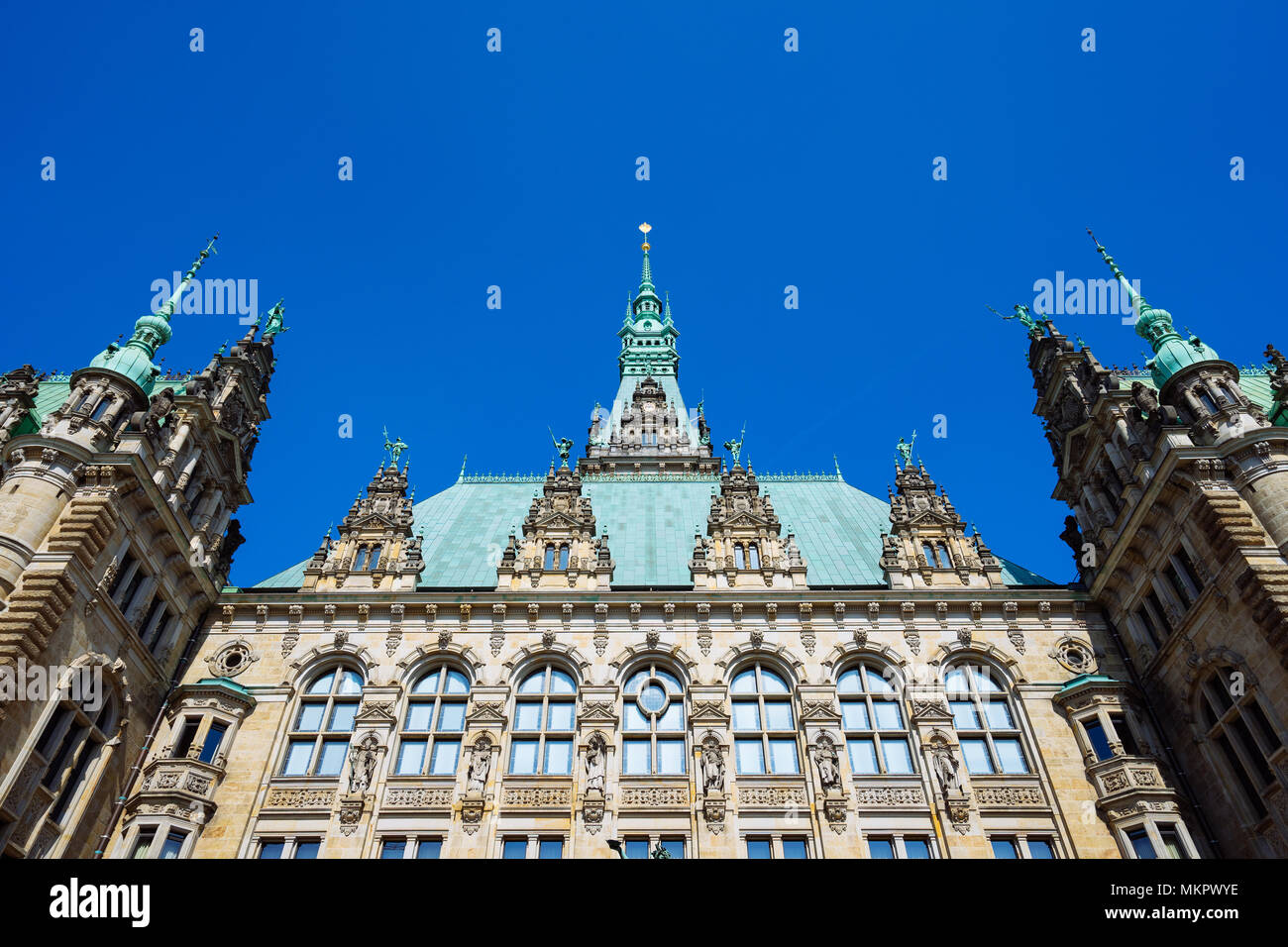Beautiful famous Hamburg town hall building with green colored roof in
