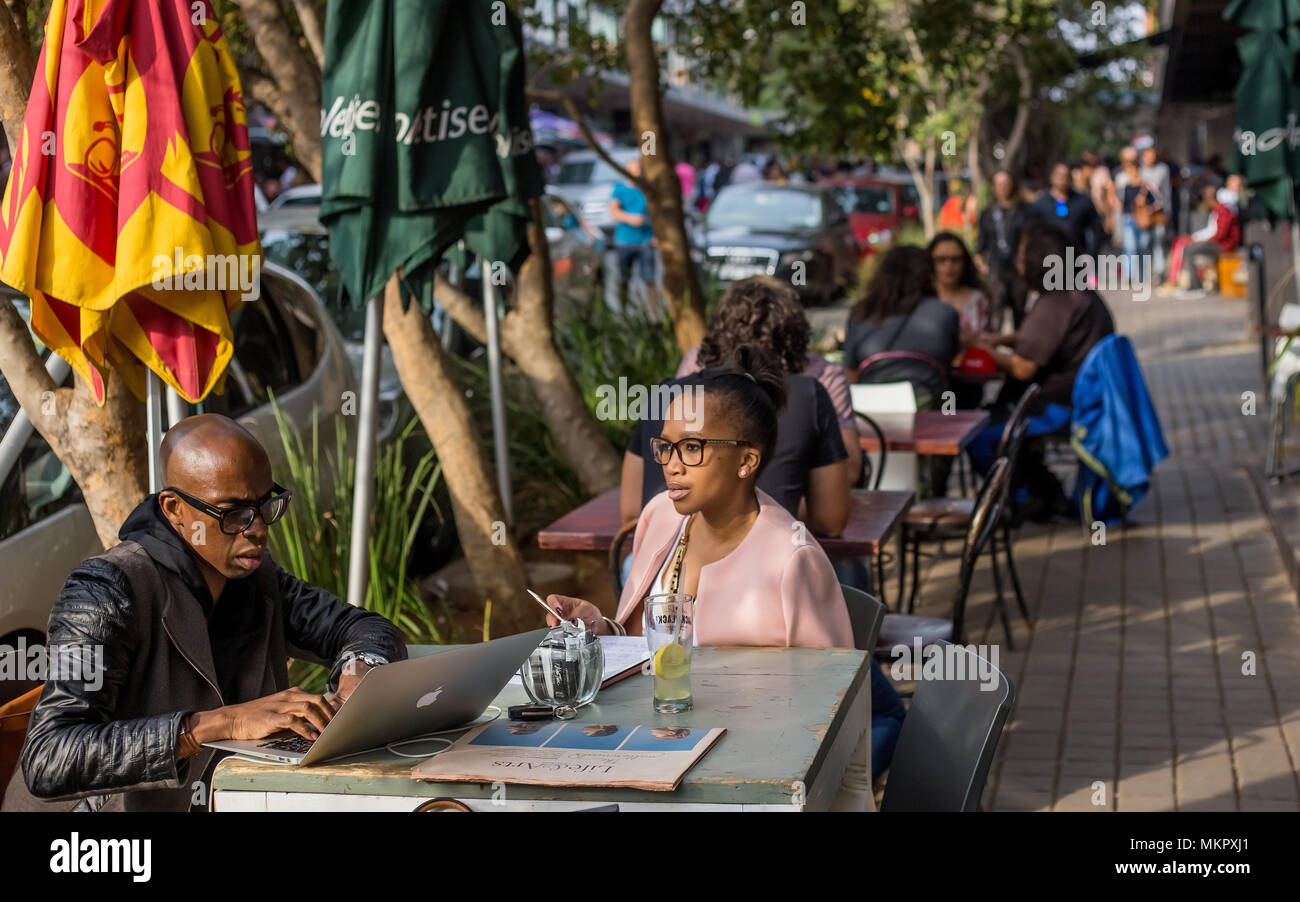 Johannesburg, South Africa, April 292018 Couple sitting at street