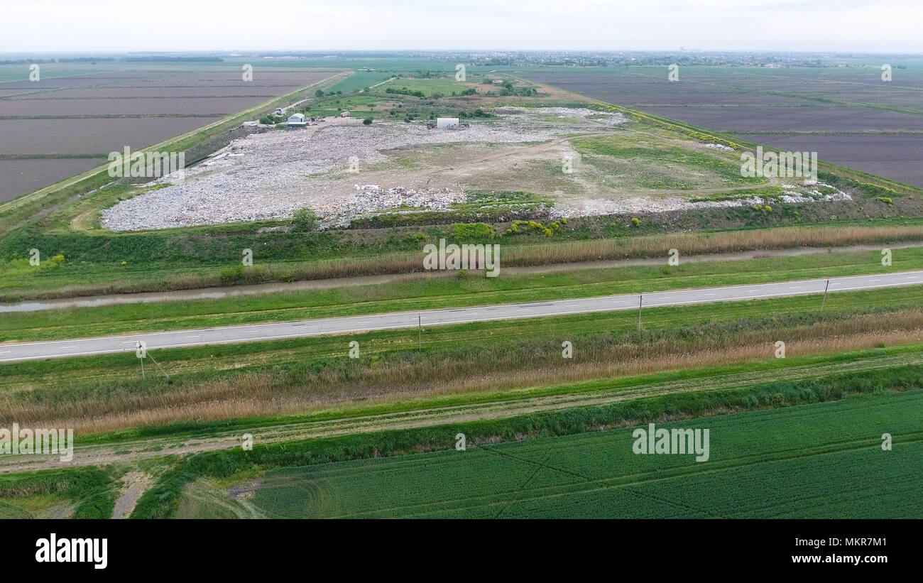 garbage dump with heaps of garbage and treatment facilities. Landfill