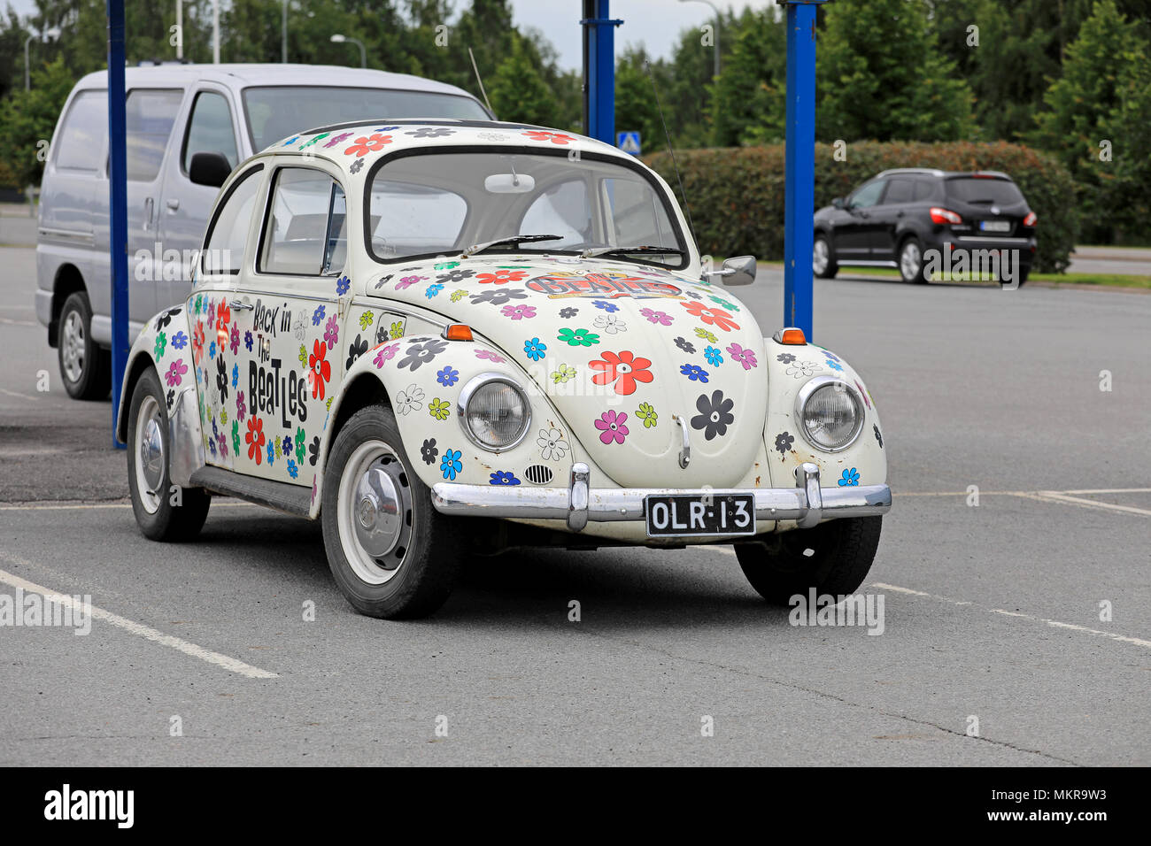 Back in the Beatles Volkswagen Beetle, or Volkswagen Type 1, painted with flower design celebrates Beatles event in Lapua, Finland. August 12, 2017. Stock Photo