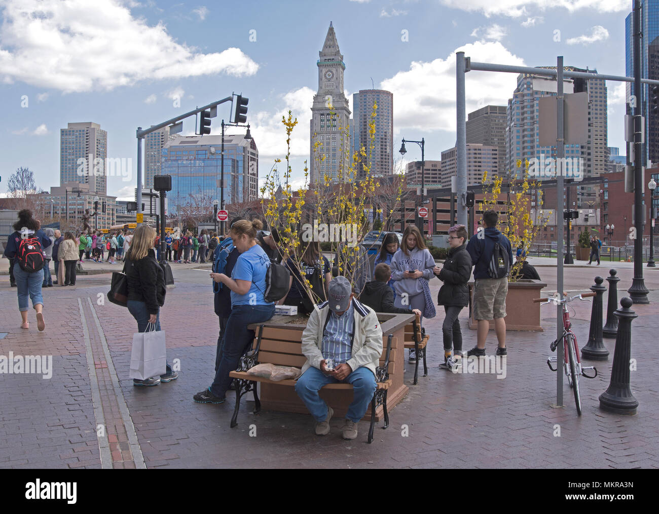 Tourists and students in Boston's North End with the city skyline in the background, Massachusetts, USA Stock Photo