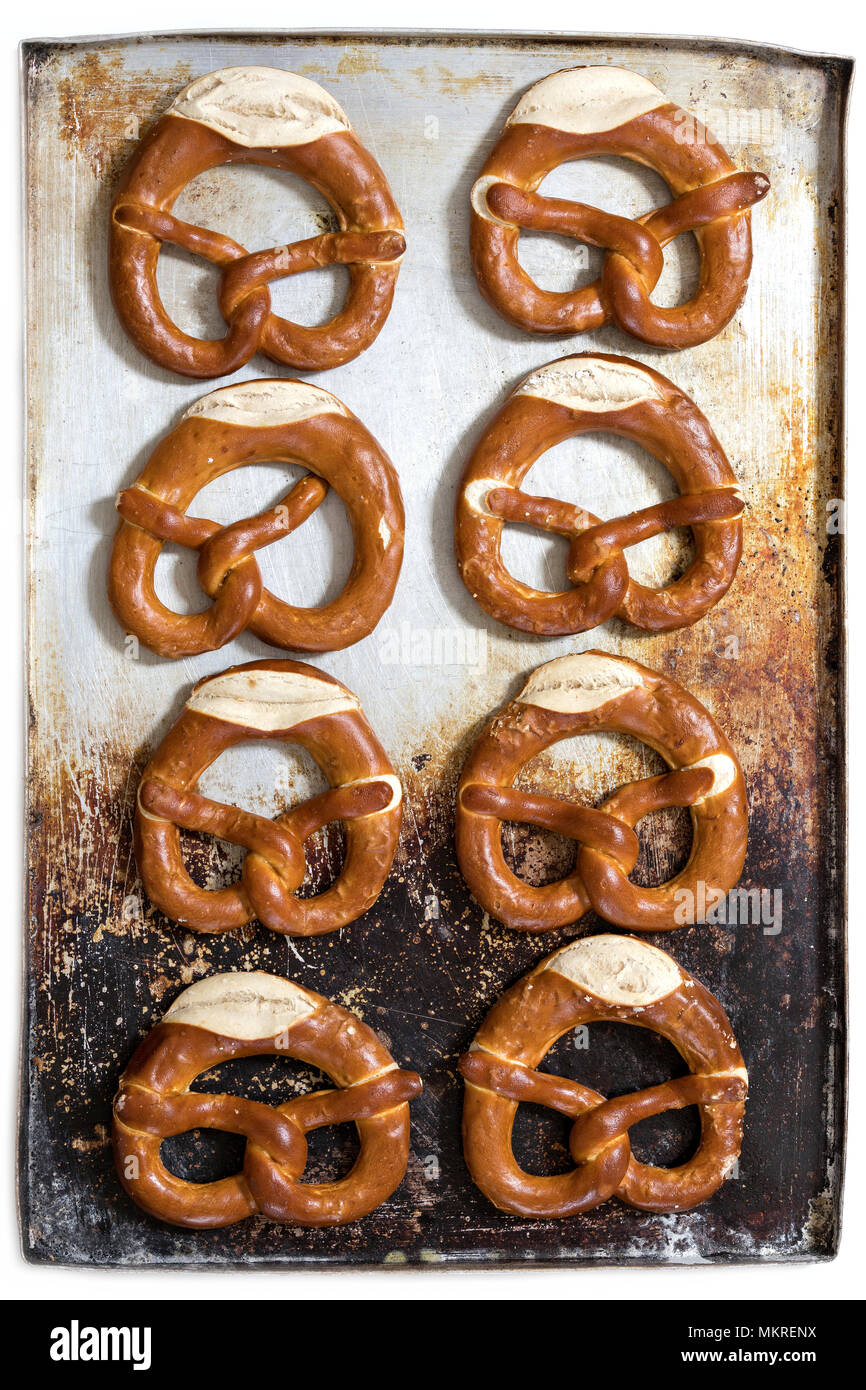pretzels on baking sheet isolated on white background Stock Photo