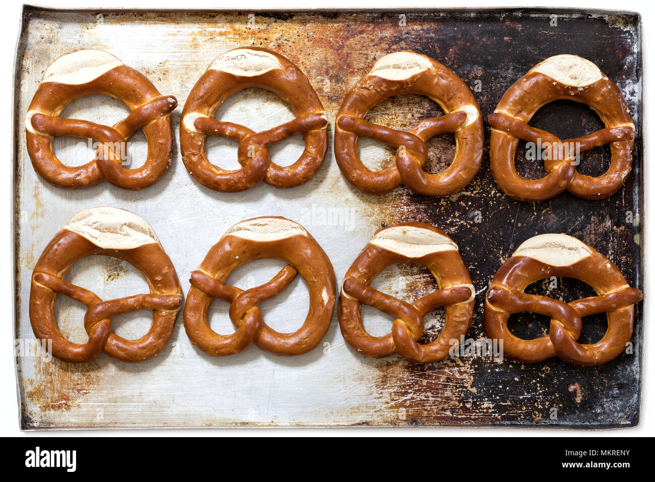 pretzels on baking sheet isolated on white background Stock Photo