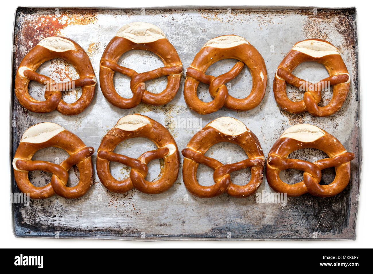 pretzels on baking sheet isolated on white background Stock Photo