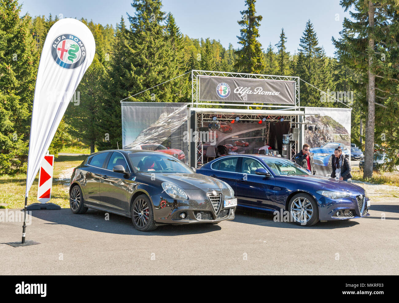 STRBSKE PLESO, SLOVAKIA - OCTOBER 01, 2017: People visit Alfa Romeo advertising stand. It is Italian car manufacturer known for sporty vehicles, a sub Stock Photo