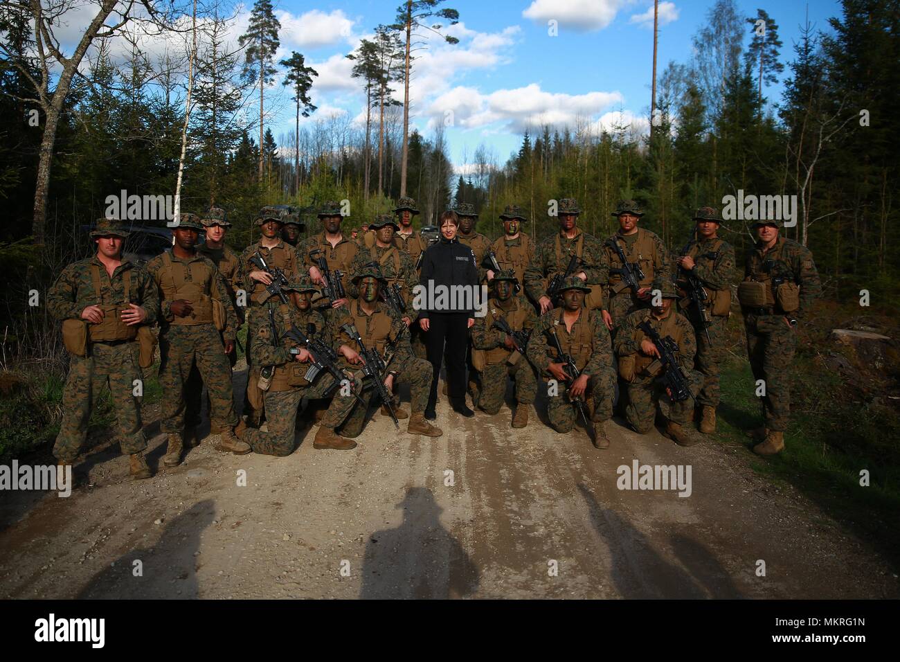 The President of Estonia Kersti Kaljulaid greets Marines and Sailors with Marine Rotational Force-Europe (MRFE) 18.1 during Exercise Hedgehog at Voru, Estonia, May 5, 2018, May 5, 2018. President Kaljulaid visited MRFE and spoke about the importance of Hedgehog, which is an annual event designed to strengthen strategic cooperation and partnership among participants. This the first time the Marine Corps has participated in the exercise. Several NATO countries also attended Hedgehog this year. (U.S. Marine Corps photo by Gunnery Sgt. Clinton Firstbrook). () Stock Photo