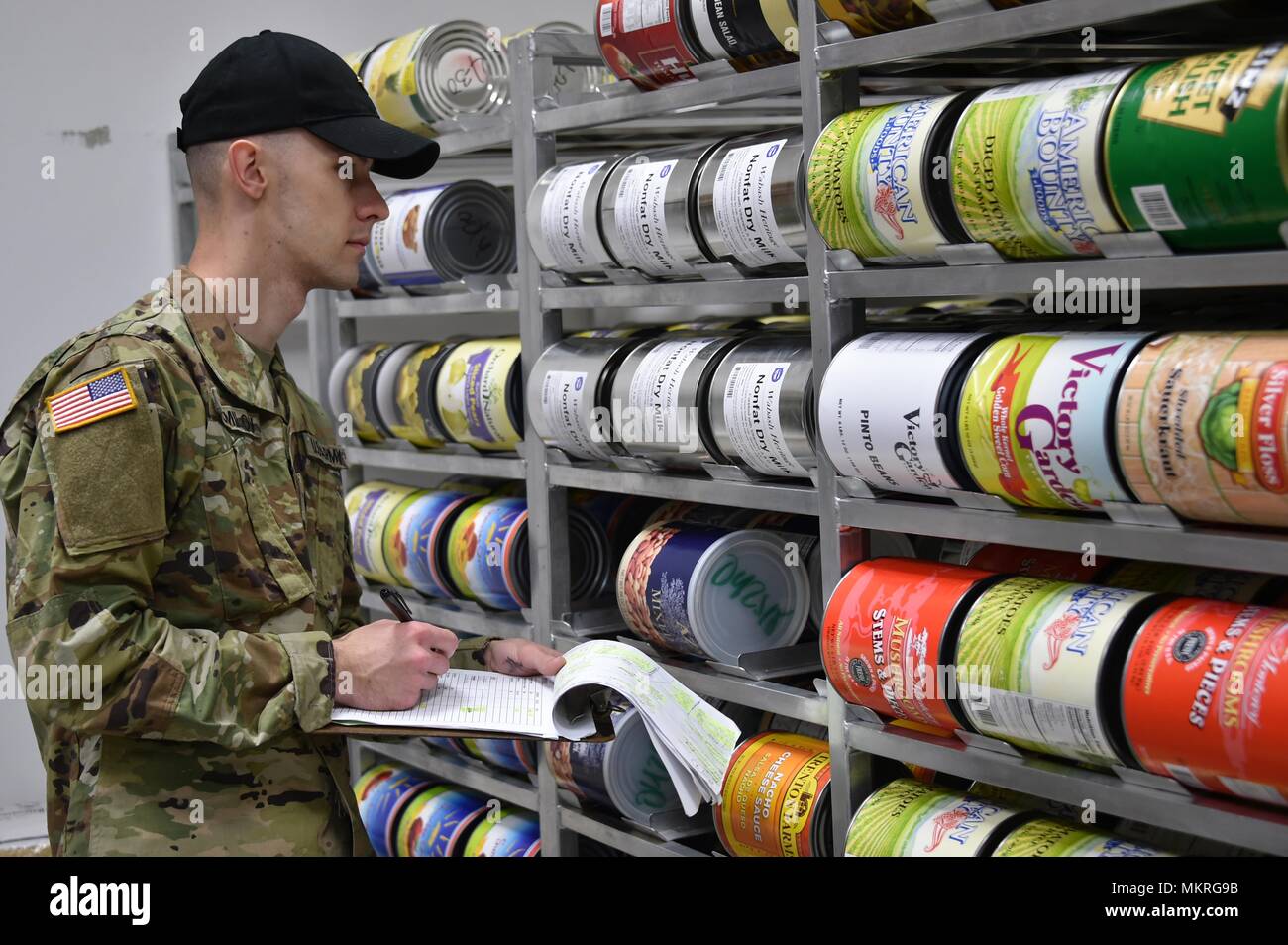 U.S. Army Spc, May 2, 2018. Dimitri Shumilov, a paratrooper with Fury Battery, 4th Battalion, 319th Airborne Field Artillery Regiment, 173rd Airborne Brigade, conducts an inventory in a supply depot at the Tower Barracks Dining Facility, Grafenwoehr, Germany, May 2, 2018. (U.S. Army photo by Gertrud Zach). () Stock Photo