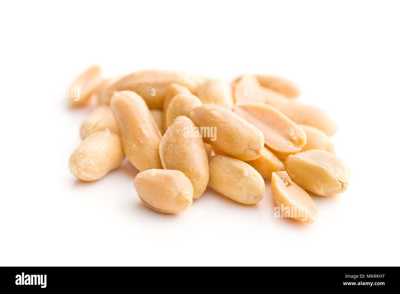 Salty roasted peanuts isolated on white background. Stock Photo