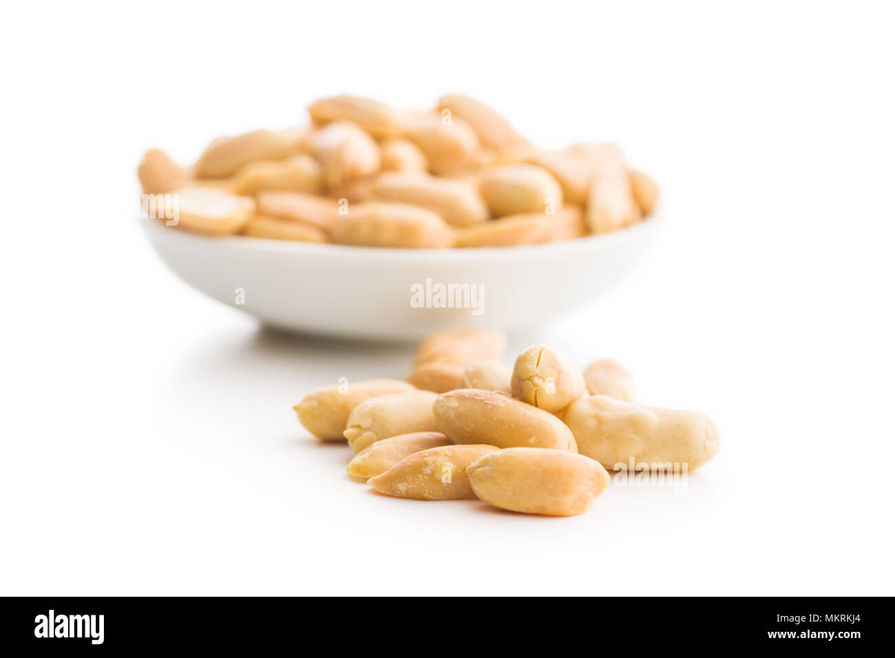 Salty roasted peanuts isolated on white background. Stock Photo