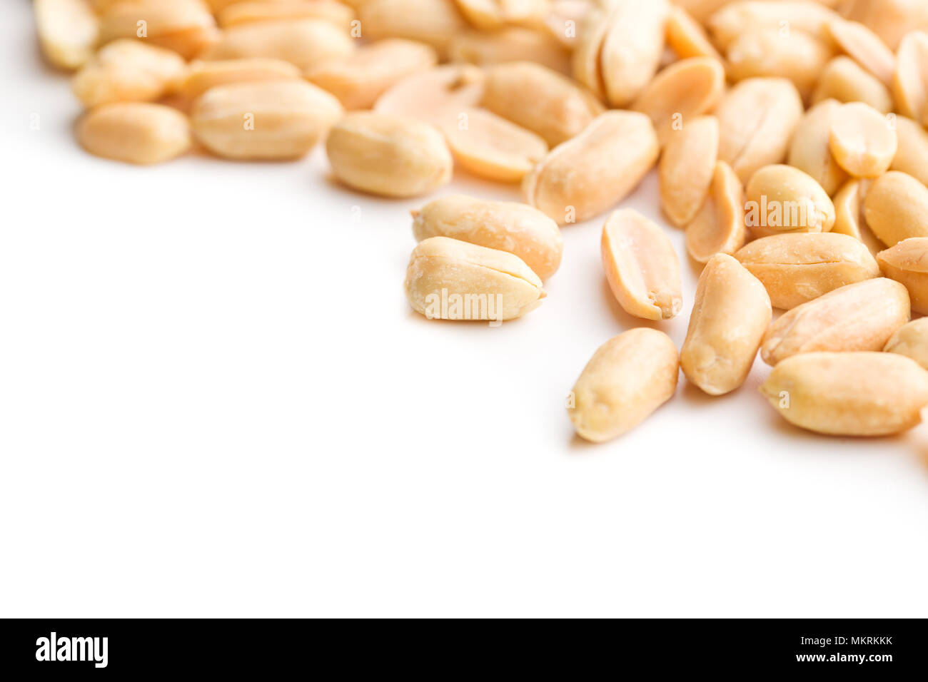Salty roasted peanuts isolated on white background. Stock Photo