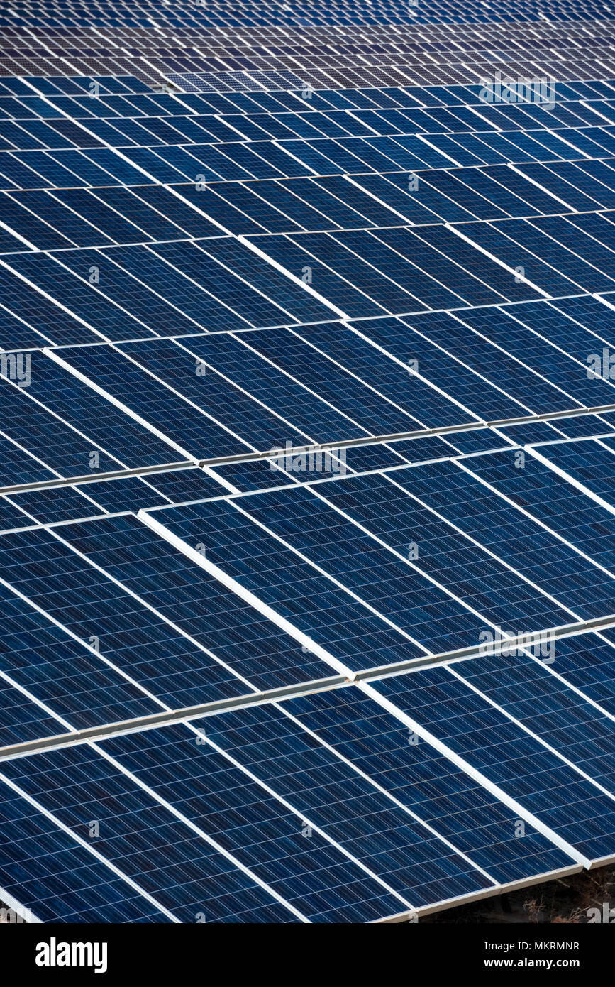 Close up of a row of solar panels in an open field with multiple solar energy panels, Calasparra, Murcia, Spain Stock Photo