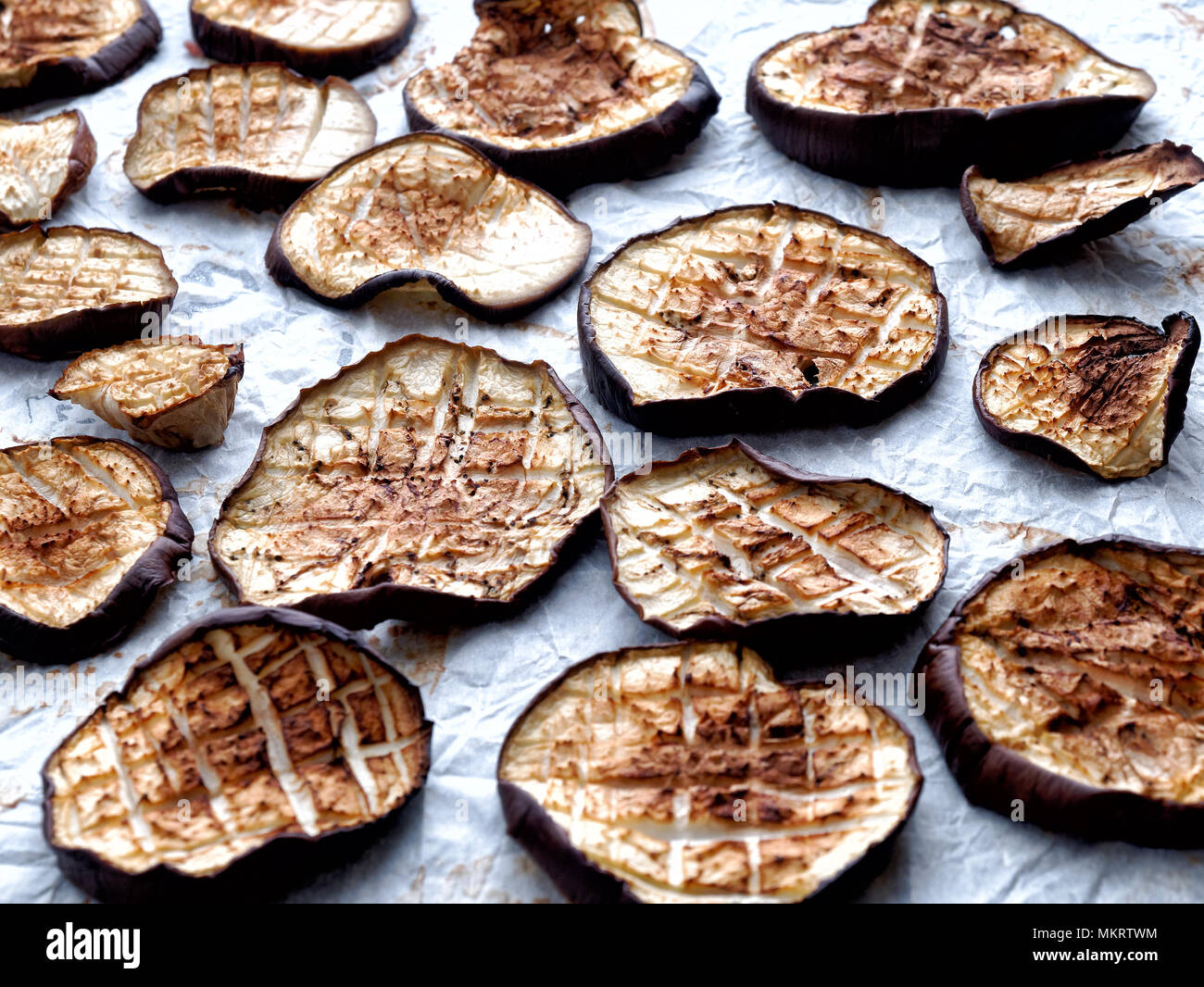Grilled eggplant slices on owen paper Stock Photo Alamy