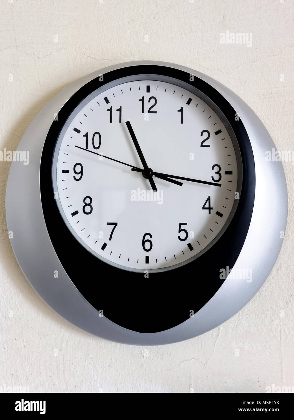 Wall clock hung on the wall Stock Photo Alamy