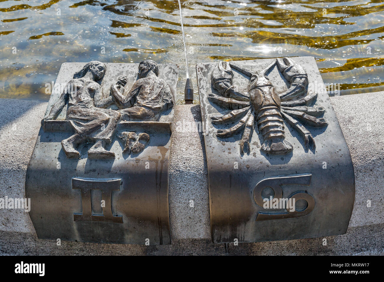 Fountain of Zodiac signs fragment with Gemini and Cancer closeup in Kosice old town, Slovakia. Stock Photo